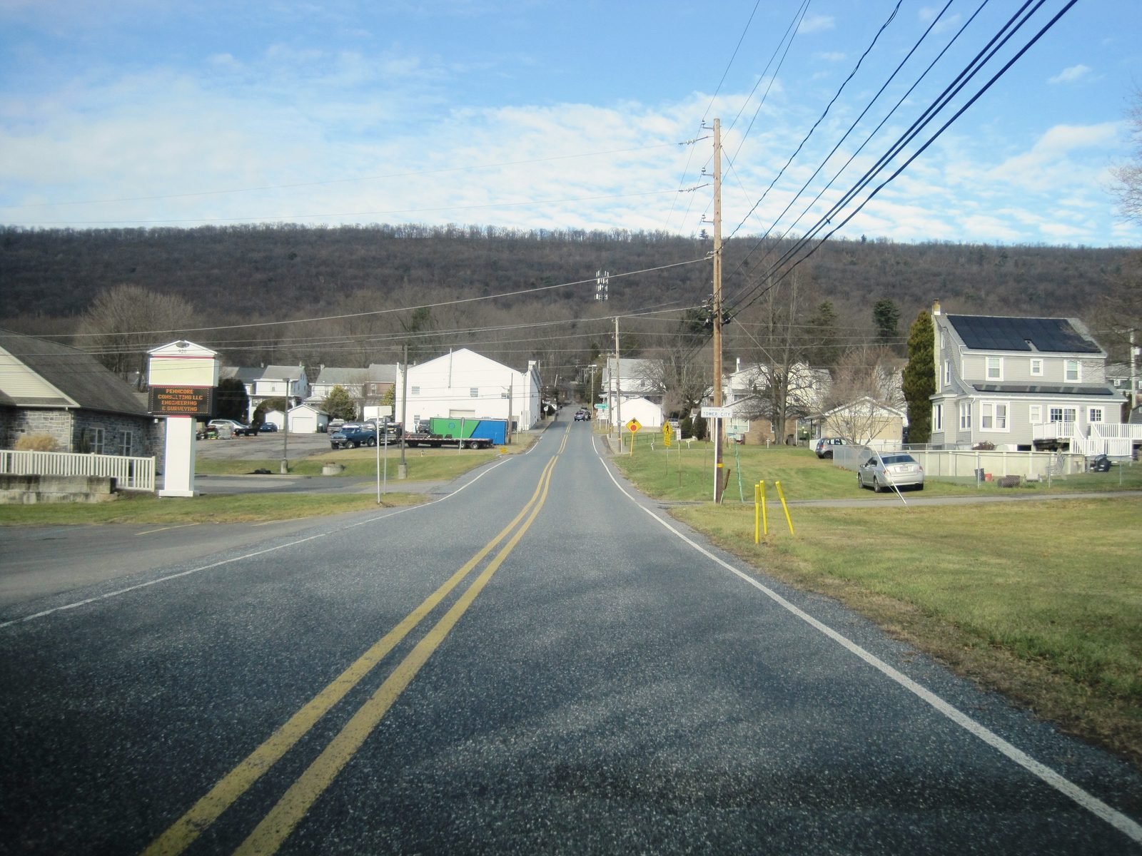 Pennsylvania Route 325 curving into Tower City under a wooded ridge
